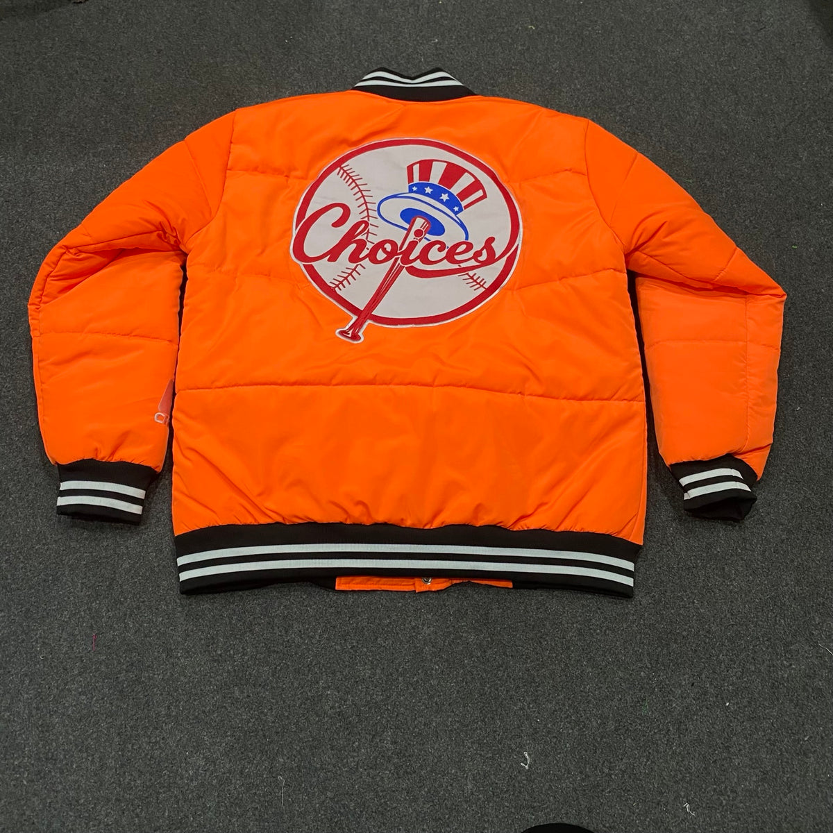 Choices Started Jacket in orange, back view